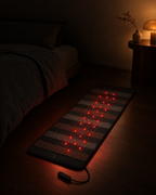 Deep Delta Field Mat laid out and lit on a bedroom floor at night